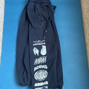 Adias Black Sweatpants with design down pant leg!